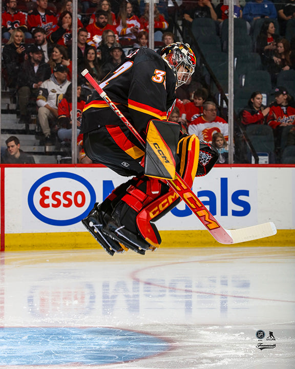 Pre-Order - Dustin Wolf Autographed Calgary Flames Alternate Jumping 8x10 Photo
