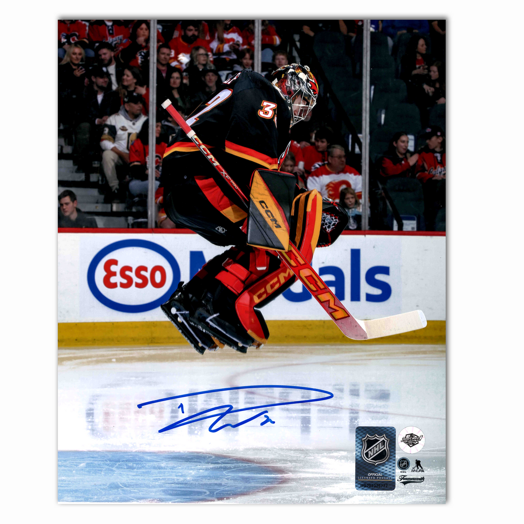 Dustin Wolf Autographed Calgary Flames Alternate Jumping 8x10 Photo