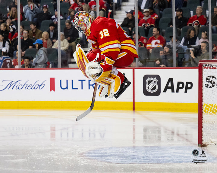 Pre-Order - Dustin Wolf Autographed Calgary Flames Home Horizontal 8x10 Photo (Jumping)