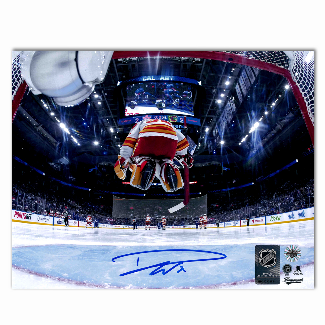 Dustin Wolf Autographed Calgary Flames Jumping In Net Away 8x10 Photo