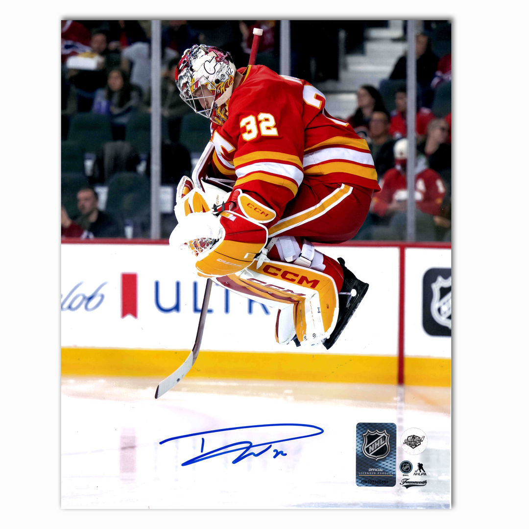 Dustin Wolf Autographed Calgary Flames Home Jumping 8x10 Photo