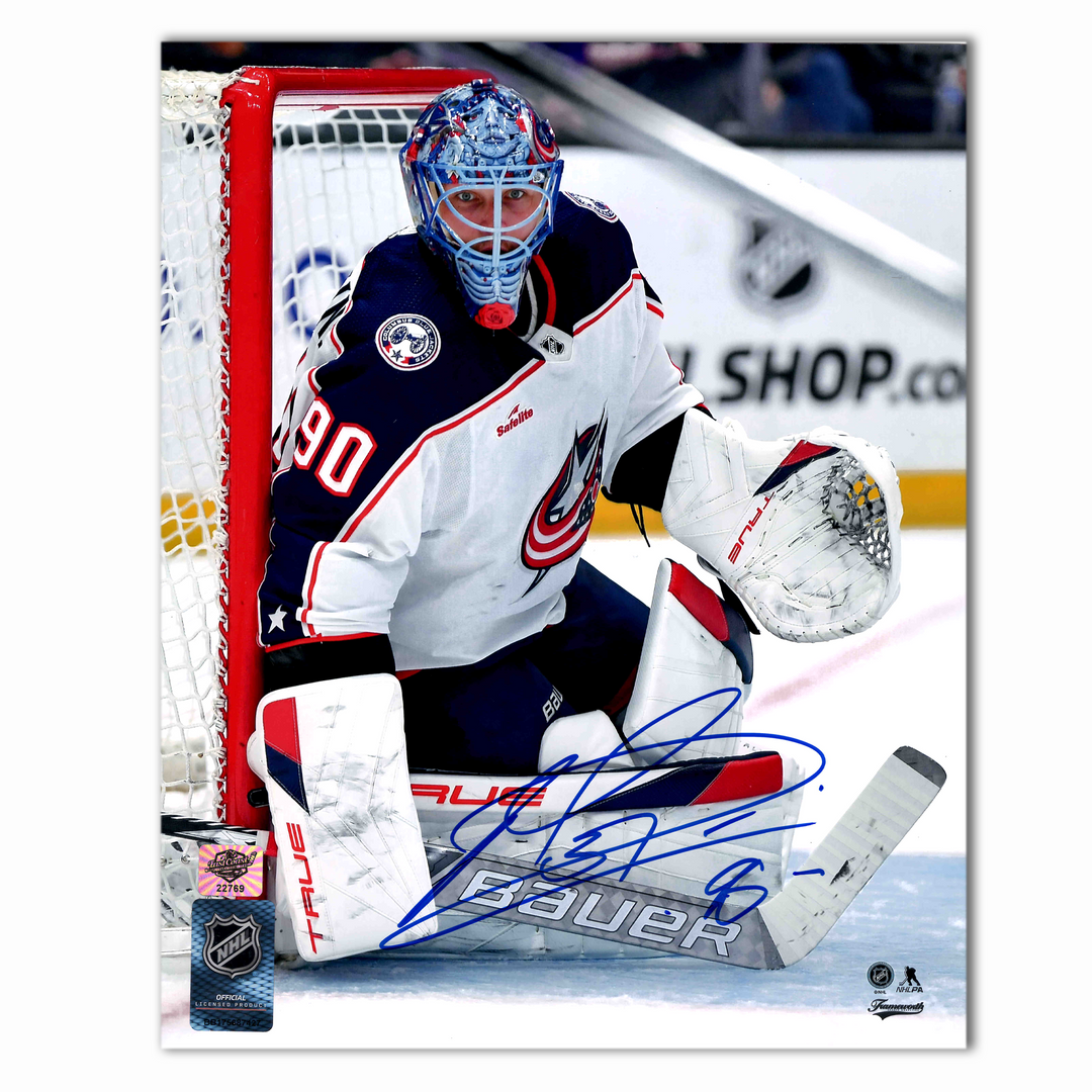 Elvis Merzlikins Autographed Columbus Blue Jackets Away Photo 8x10