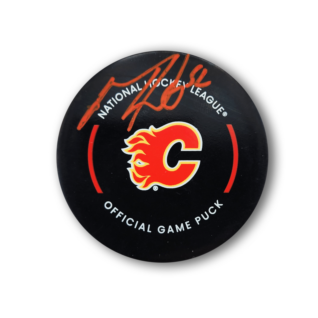 MacKenzie Weegar Autographed Calgary Flames Official Hockey Puck