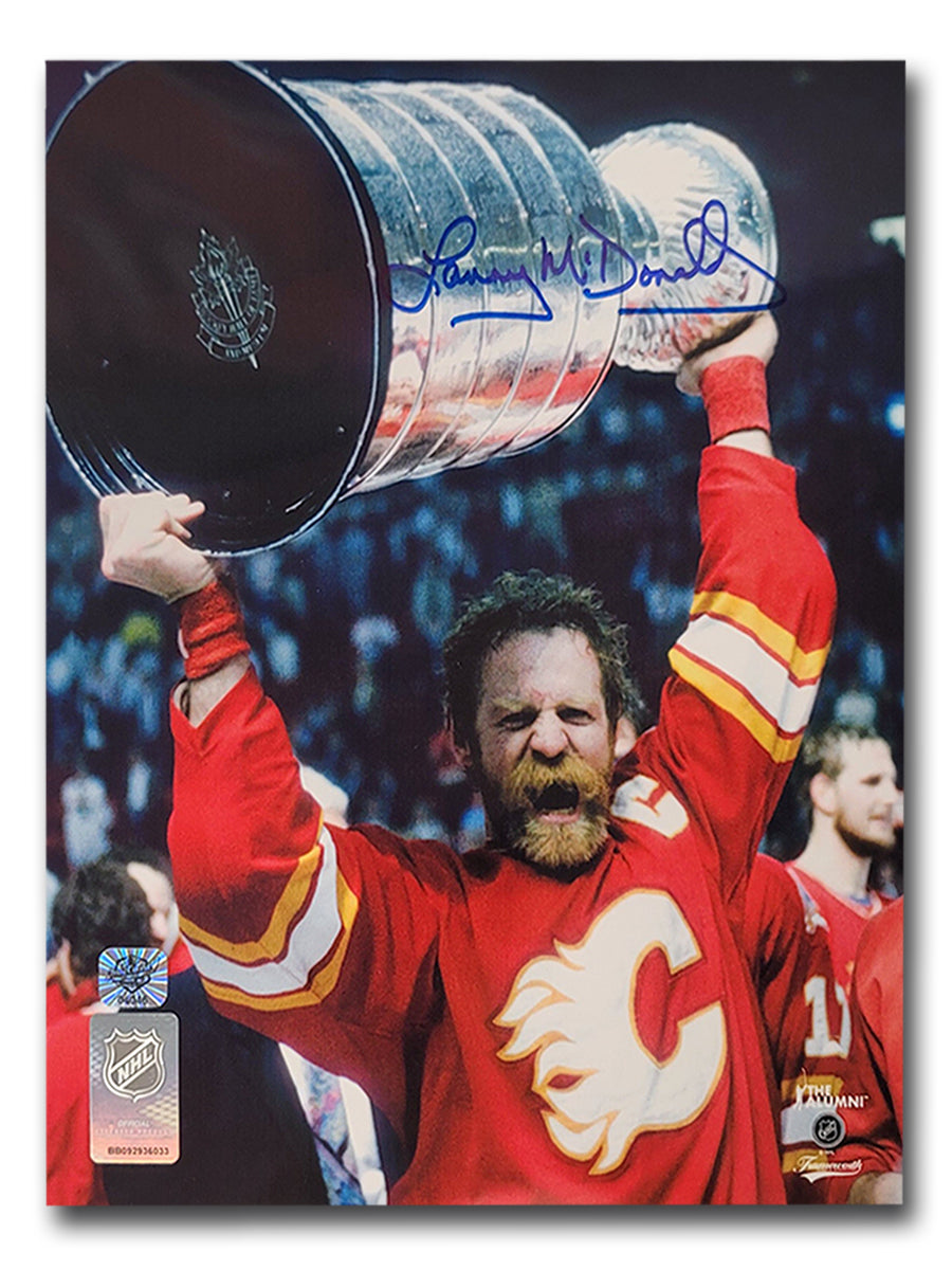 Lanny McDonald Calgary Flames Autographed Holding Stanley Cup Above Head 8x10